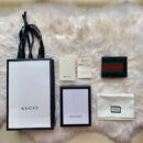 408827 GUCCI 古驰 男士黑色牛皮红绿条纹双G压纹短款钱包